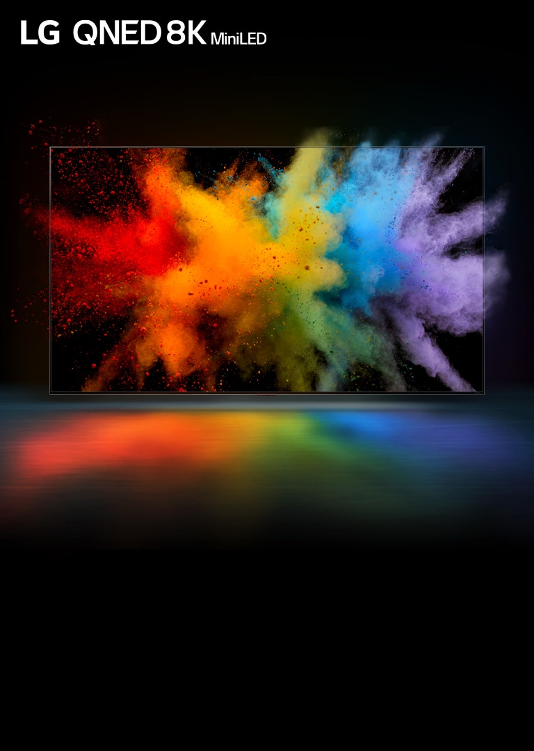 Ein Fernseher befindet sich in einem schwarzen Raum. Buntes Farbpulver explodiert auf dem TV-Bildschirm.