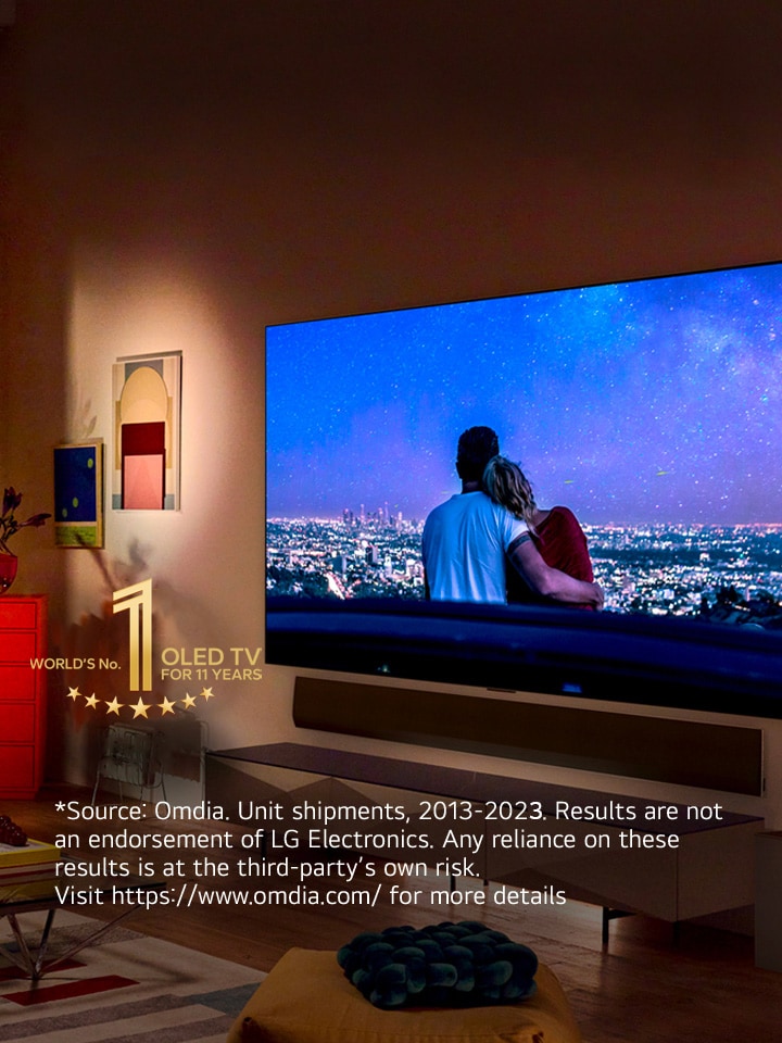 An image of LG OLED evo G3 on the wall of a modern and quirky New York City apartment with a romantic night scene playing on the screen.  10 Year World's No.1 OLED TV emblem. 