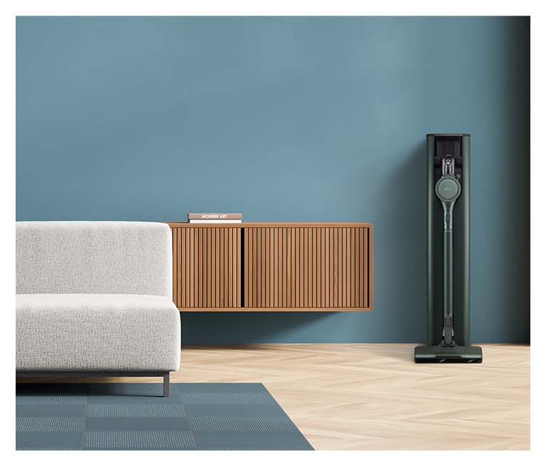 It shows nature green color LG Objet Collection A9T-Steam is placed in a blue-tone modern living room.