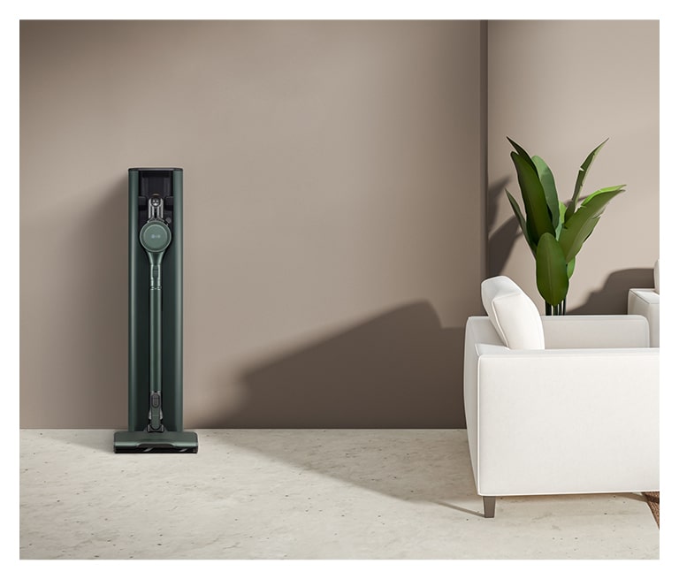 It shows nature green color LG Objet Collection A9T-Steam is placed in a brown-tone modern living room.