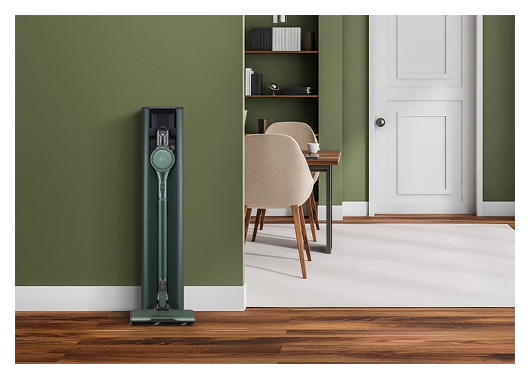 It shows LG Objet Collection A9T-Steam is placed in a green-tone modern living room.