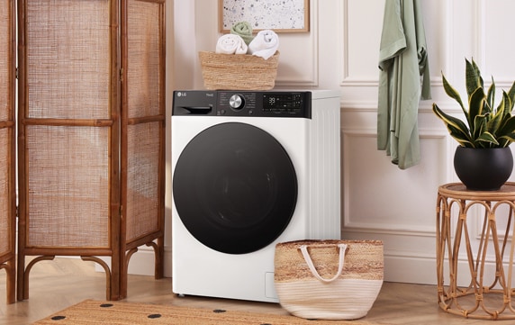 come lavare le lenzuola in lavatrice: foto di una lavanderia in cui c’è una lavatrice LG per lavare le lenzuola