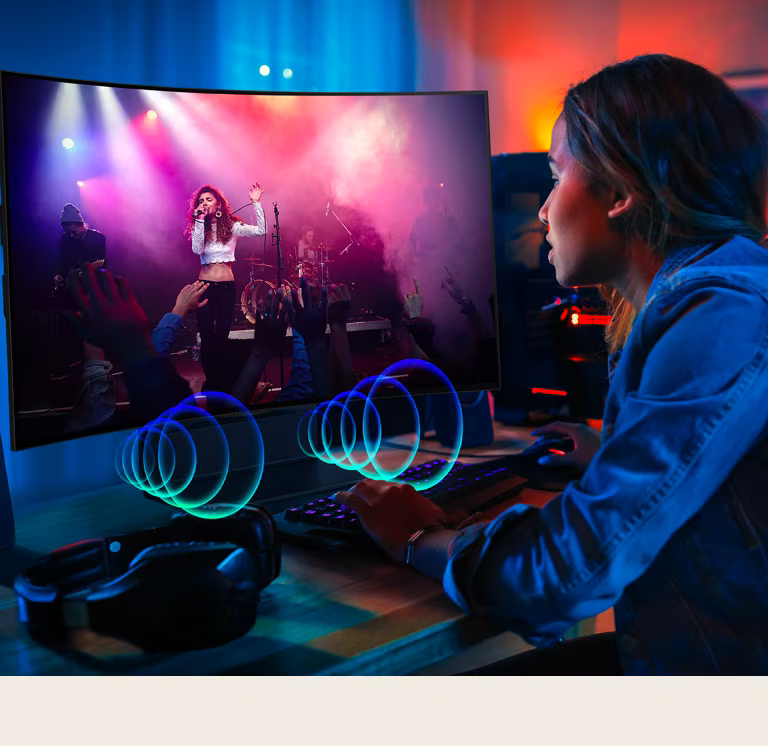 LG OLED Flex でコンサートを干渉している人の画像です。音紋はテレビの前面から出る音楽を表しています。