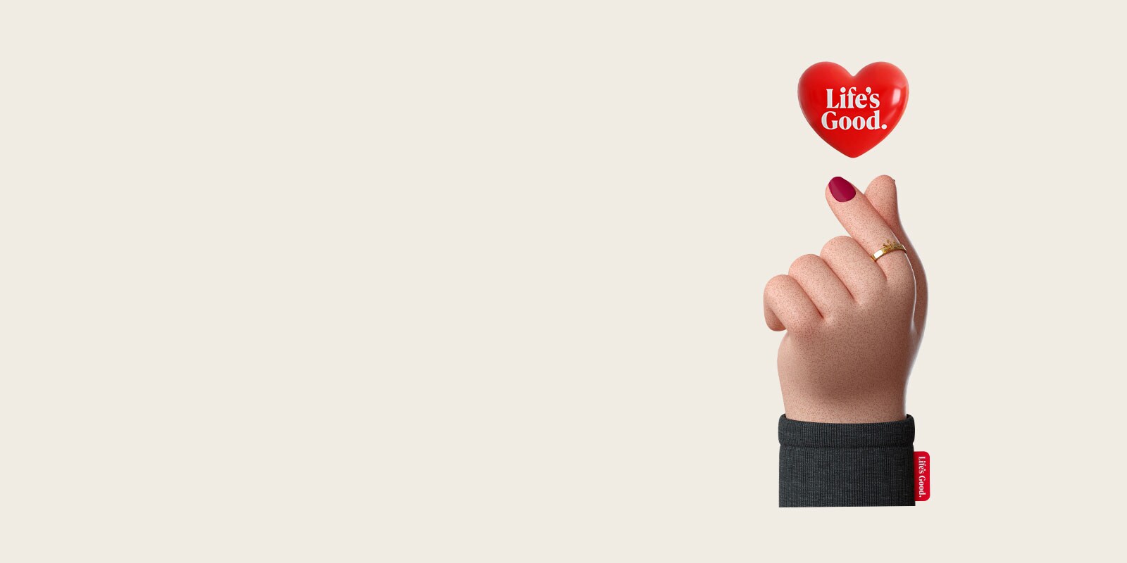 Ένα ψηφιακό χέρι σχηματίζει μια καρδιά με τον αντίχειρα και τον δείκτη, και πάνω από τη χειρονομία εμφανίζεται μια κόκκινη καρδιά με το λογότυπο «Life’s Good» της LG.