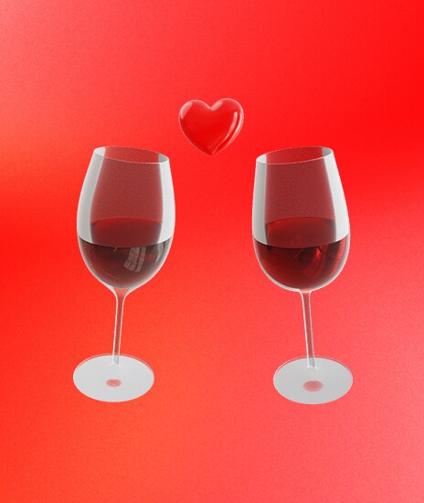 Δύο ποτήρια κρασιού τσουγκρίζουν μαζί με το σκίτσο μιας κόκκινης καρδιάς ανάμεσά τους.