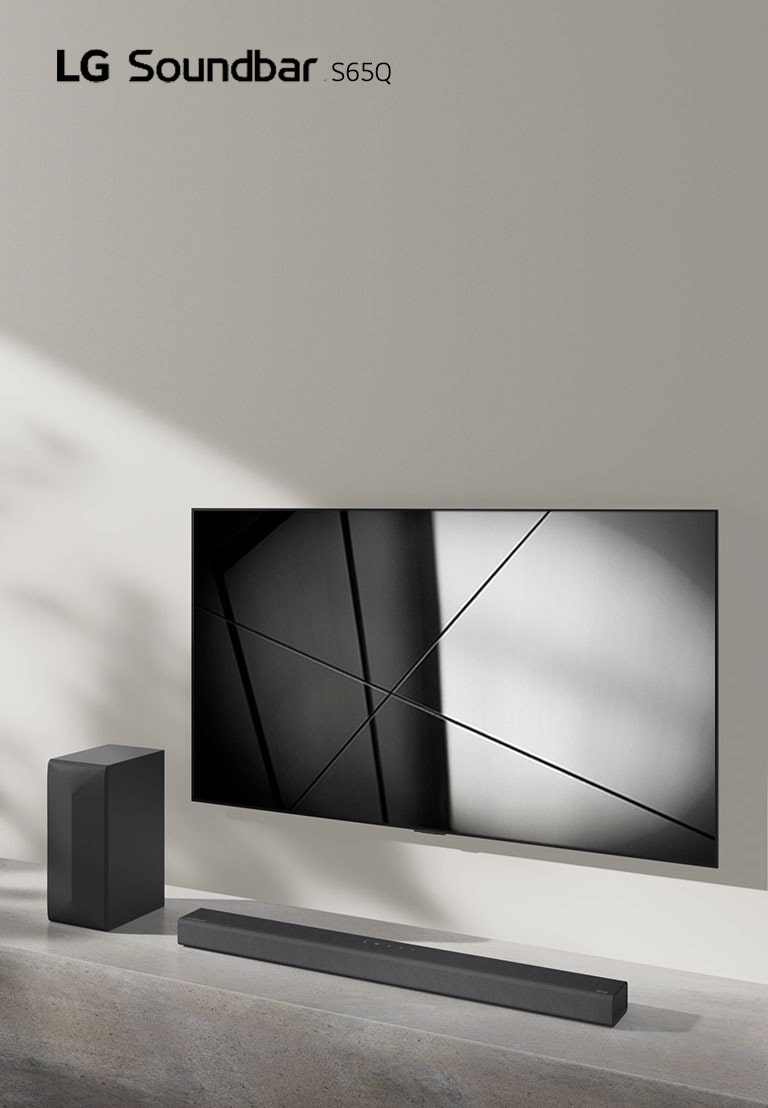 LG sound bar S65Q and LG TV are placed together in the living room. The TV is on, displaying a black and white image.