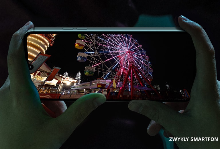 Video of the nightly amusement park playing on the screen of smartphone.